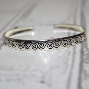 Pretty silver cuff bracelet with swirl pattern one size